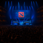 Auditorio lleno en un torneo de Dota 2 con escenario iluminado y logo al centro.